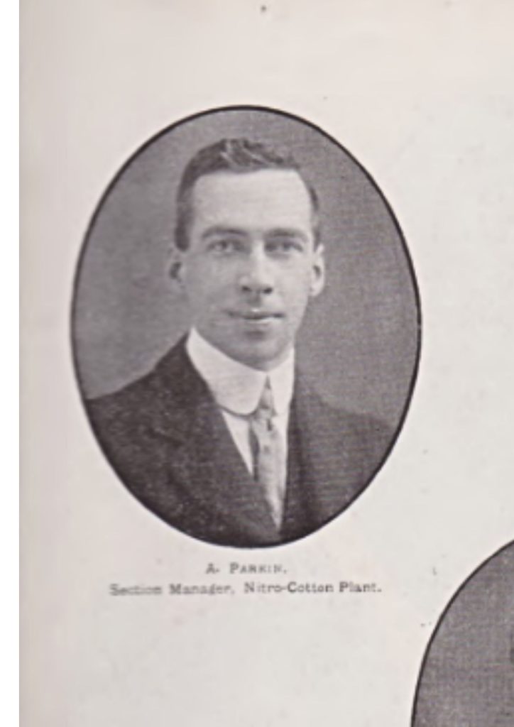 An oval shaped portrait of Arthur Parkin from the Dornock Souvenir Magazine. He is wearing a suit and looks happy.