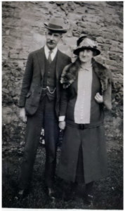William Robert Scott stood next to his and his wife Elizabeth. This is a black and white photo from the past.